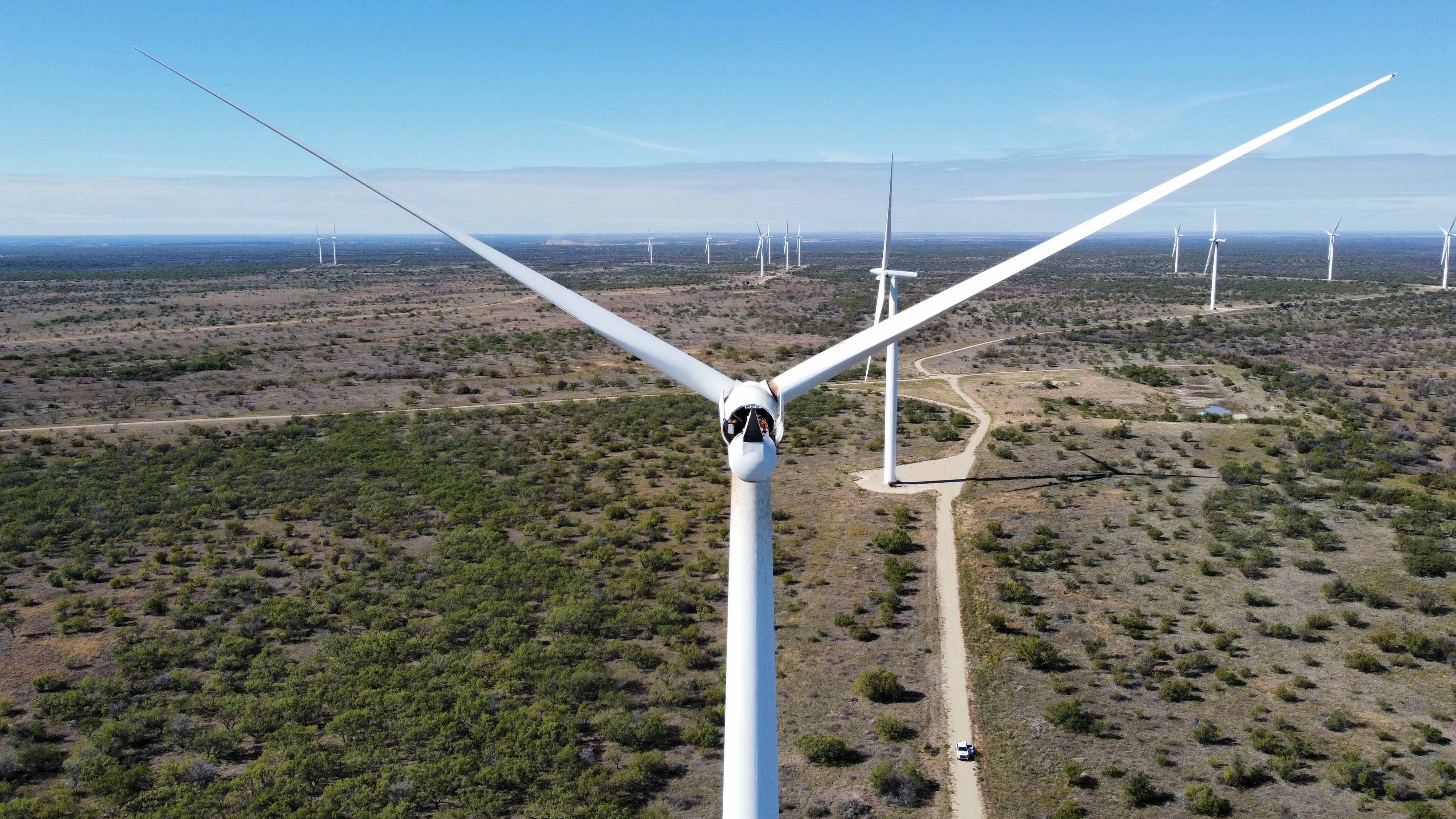 Aerial view of Hackberry Wind Farm in Shackleford County, Texas, showing refurbished turbines generating clean energy across open prairie landscape.
